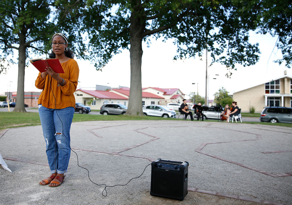 Shakira Cross, a 2018 Hickman High School graduate, reads a poem she wrote